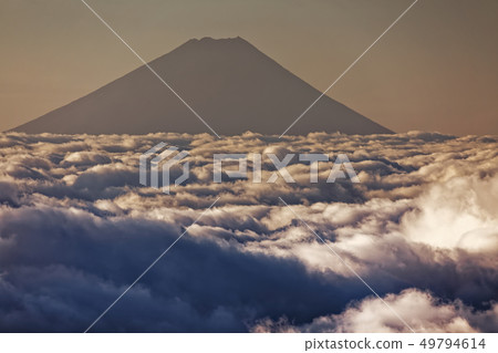Clouds of the dawn seen from Yatsugatake mountain range and the front three heads and Mt. Fuji 49794614
