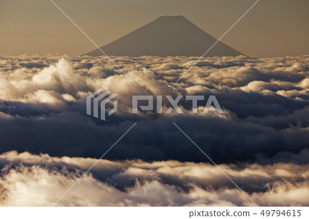 Clouds of the dawn seen from Yatsugatake mountain range and the front three heads and Mt. Fuji 49794615