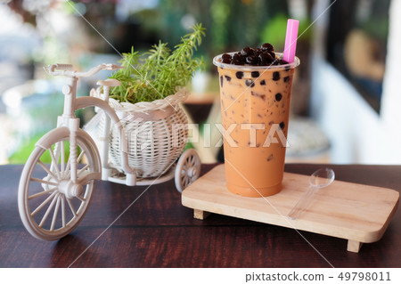 Ice bubble milk tea in takeaway glass. 49798011