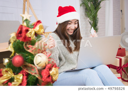 Woman uses credit card shopping online. Woman uses credit card shopping online. 49798826