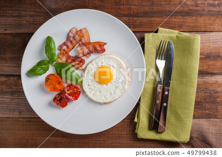 Fried egg and bacon 49799438