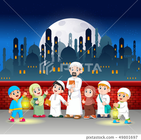 the children and teacher are standing in front 49801697