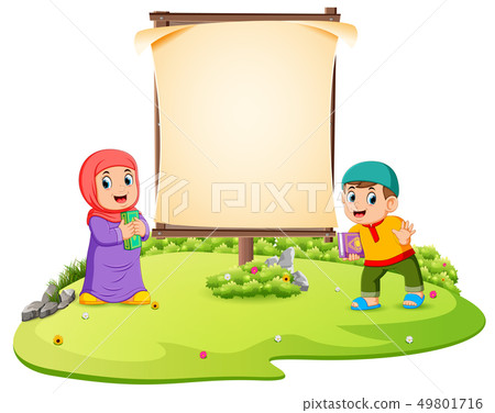 two children are standing in the green garden  49801716