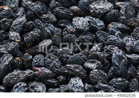 Black Raisin texture, popular dried fruit. Dried 49802636