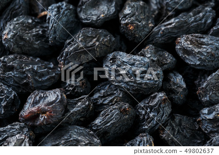 Black Raisin texture, popular dried fruit. Dried 49802637
