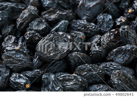 Black Raisin texture, popular dried fruit. Dried 49802641