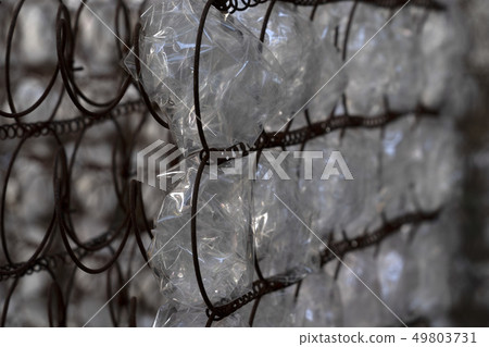 many plastic bottle on grid 49803731