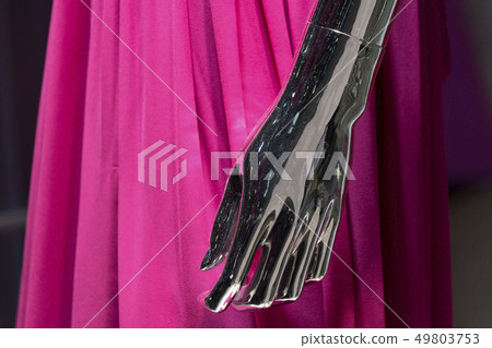 Silver woman mannequin hand detail with pink dress 49803753