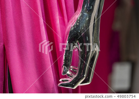 Silver woman mannequin hand detail with pink dress 49803754