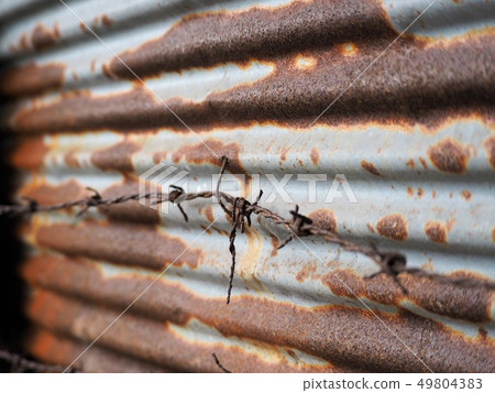 Rusty entangled dangerous wire, rusted galvanized steel background 49804383