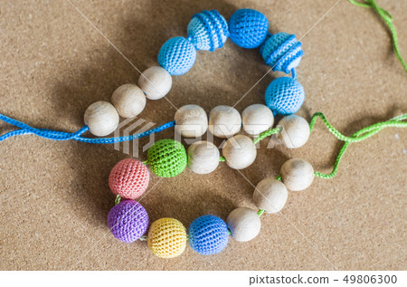 Necklace made from knitted beads and toys for the Necklace made from knitted beads and toys for the 49806300