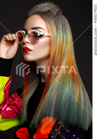 Beautiful girl with multi-colored hair and creative make-up and hairstyle. Beauty face. Beautiful girl with multi-colored hair and creative make-up and hairstyle. Beauty face. 49807403