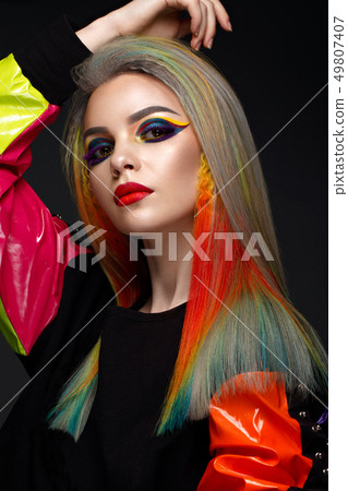 Beautiful girl with multi-colored hair and creative make-up and hairstyle. Beauty face. Beautiful girl with multi-colored hair and creative make-up and hairstyle. Beauty face. 49807407