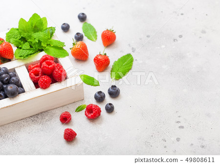 Fresh raw organic berries isolated in white wooden Fresh raw organic berries isolated in white wooden 49808611