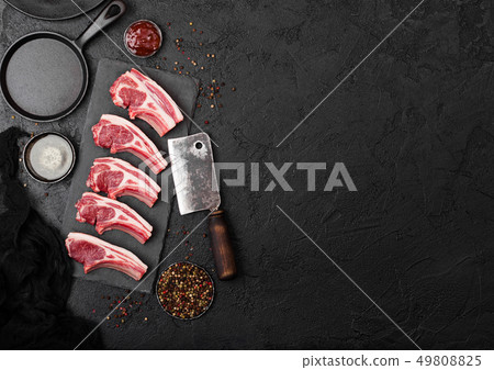 Fresh raw butchers lamb beef cutlets on stone Fresh raw butchers lamb beef cutlets on stone 49808825