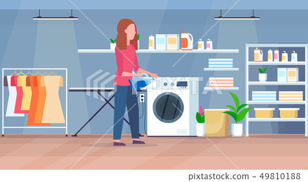 woman pouring powder gel into washing machine housewife doing housework modern laundry room interior 49810188