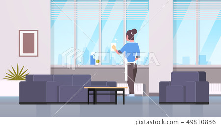 woman in gloves and apron cleaning windows with rag cleaner spray rear view housewife doing 49810836