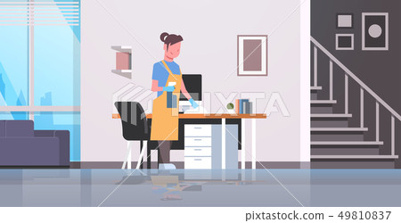 housewife cleaning computer table with duster woman wiping workplace desk girl dusting housework housewife cleaning computer table with duster woman wiping workplace desk girl dusting housework 49810837