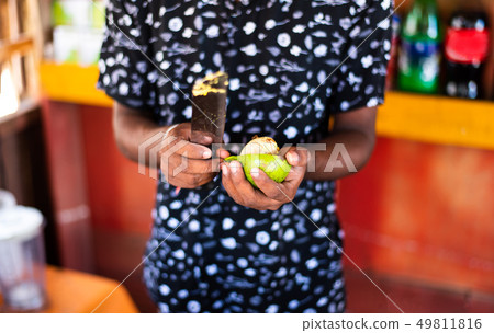 Man cutting avocado in a bar 49811816