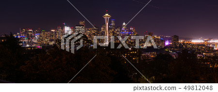 Panoramic night view of the Seattle skyline with the Space Needle and other iconic buildings in the Panoramic night view of the Seattle skyline with the Space Needle and other iconic buildings in the 49812048