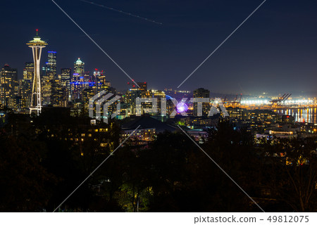 Night view of the Seattle skyline with the Space Needle and other iconic buildings in the background Night view of the Seattle skyline with the Space Needle and other iconic buildings in the background 49812075