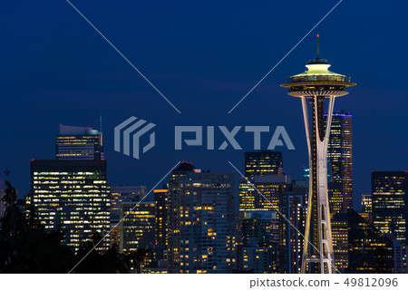 Night view of the Seattle skyline with the Space Needle and other iconic buildings in the background Night view of the Seattle skyline with the Space Needle and other iconic buildings in the background 49812096