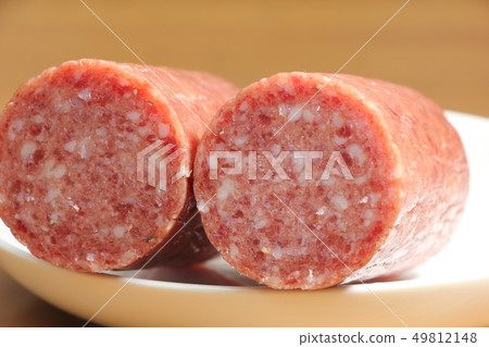 Cross section of soft salami. 49812148