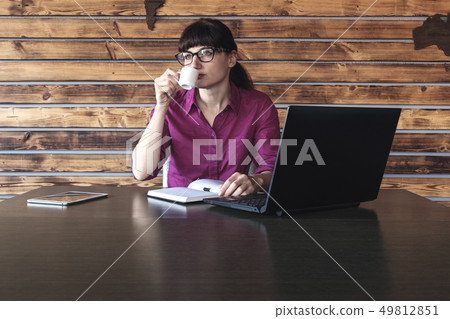 Businesswoman concentrating on her work Businesswoman concentrating on her work 49812851