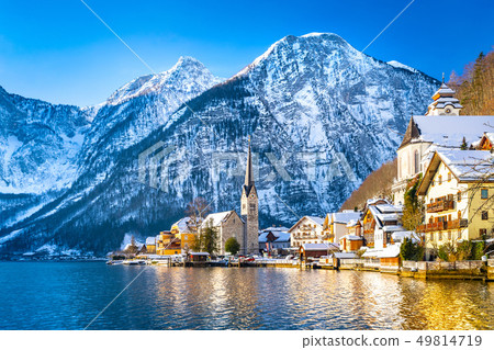 Classic postcard view of famous Hallstatt lakeside town in the Alps with traditional passenger ship Classic postcard view of famous Hallstatt lakeside town in the Alps with traditional passenger ship 49814719