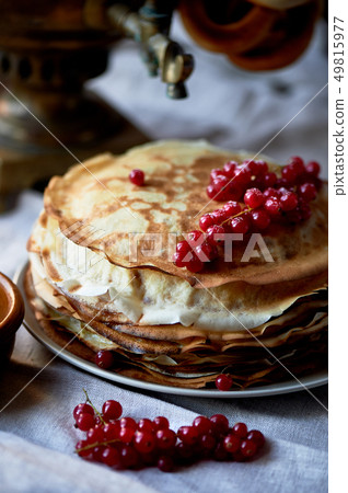 stack of pancakes with red juicy currants. stack of pancakes with red juicy currants. 49815977
