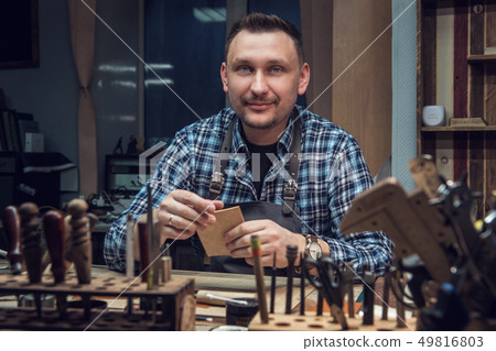 Concept of handmade craft production of leather goods. 49816803