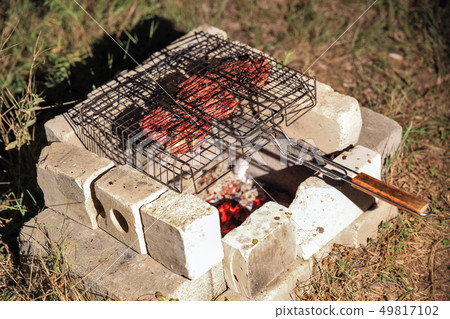 cooking grilled steaks cooking grilled steaks 49817102