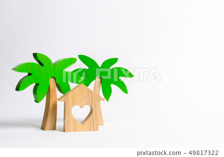Wooden palm tree and house with hearts Wooden palm tree and house with hearts 49817322