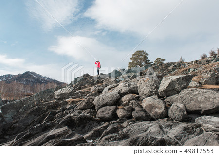 Happy woman relaxing on the top of mountain Happy woman relaxing on the top of mountain 49817553