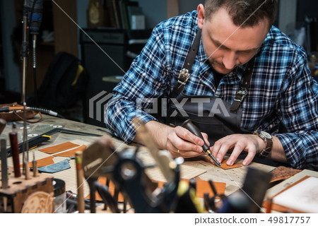 Concept of handmade craft production of leather goods. 49817757