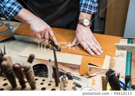 Concept of handmade craft production of leather goods. 49818113