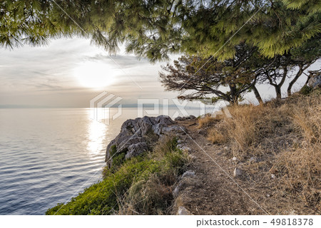 Sunset on the Adriatic sea view from the rocky shore 49818378