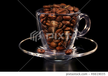 Beautiful cup and coffee aromatic grains of brown Beautiful cup and coffee aromatic grains of brown 49819035