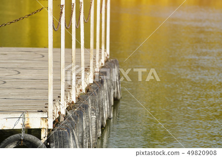 River pier on the background reflected in the River pier on the background reflected in the 49820908