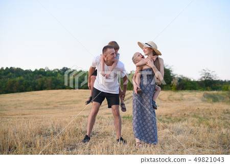 Happy young family. A father, a pregnant mother, Happy young family. A father, a pregnant mother, 49821043