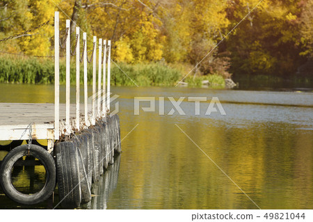 River pier on the background reflected in the River pier on the background reflected in the 49821044