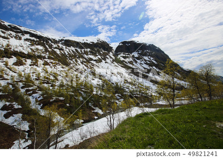 Spring mountains and melting snow 49821241