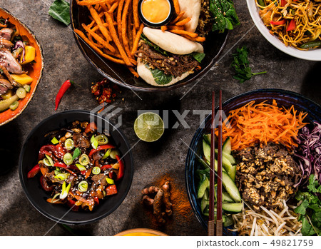 Asian food background with various ingredients on rustic stone background , top view. 49821759
