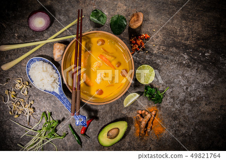 Yellow curry asian food background with various ingredients on rustic stone background. Yellow curry asian food background with various ingredients on rustic stone background. 49821764