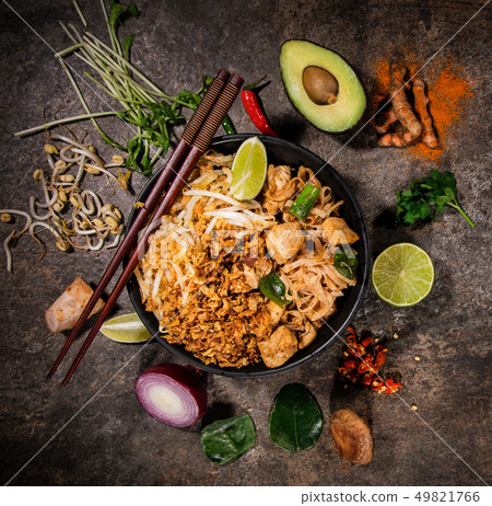 Pad thay asian food background with various ingredients on rustic stone background , top view. Pad thay asian food background with various ingredients on rustic stone background , top view. 49821766