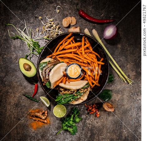 Taiwan bao asian food background with various ingredients on rustic stone background , top view. Taiwan bao asian food background with various ingredients on rustic stone background , top view. 49821767