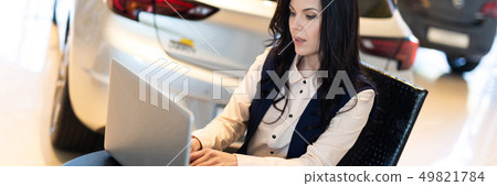 Portrait of beautiful sales manager working on the laptop Portrait of beautiful sales manager working on the laptop 49821784