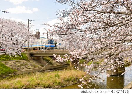 A regular train bound for Fukuoka Airport running along the Chikuhi Line Ryomejigawabashi Ryo 49827476