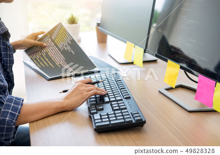 Serious busy hipster young web software developer 49828328