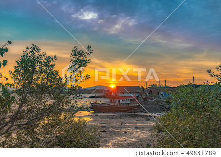 stunning sunset at fishing village in Phuket. 49831789